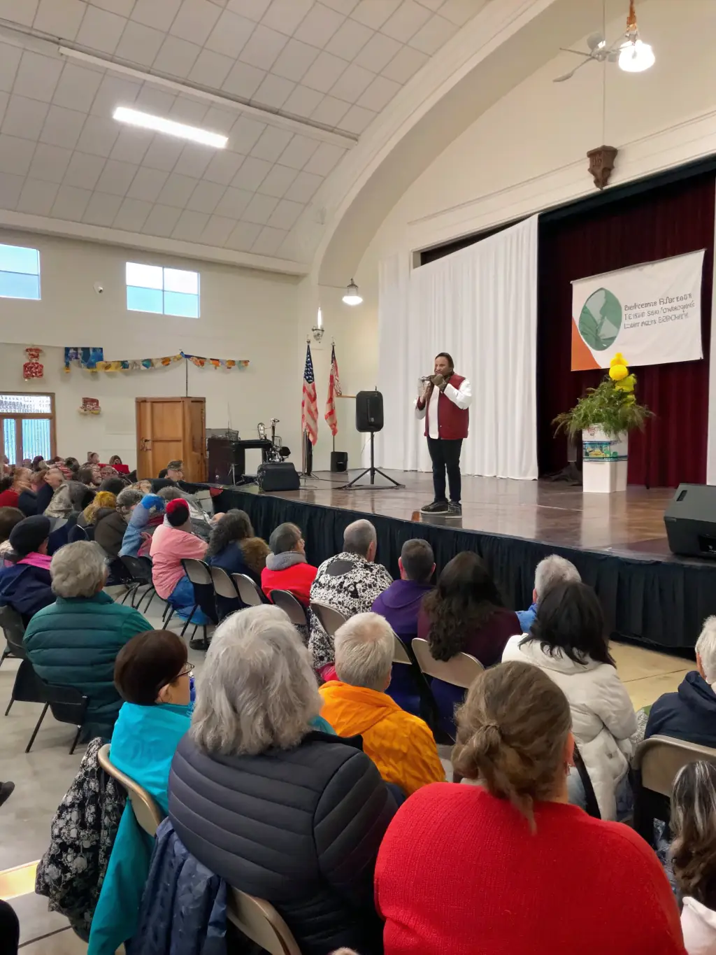 A diverse group of community members participating in a panel discussion about the legacy of the Resistance and its relevance to contemporary social issues.